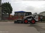 Máy xúc trượt bánh lốp Bobcat S650, máy quet bụi Bobcat